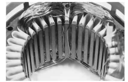 Partially inserted stator/coil assembly. Partially inserted stator/coil assembly.