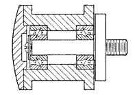 Typical tape-guide design using screw and washer for solid preloading by clamping inner rings, with outer-ring rotation.