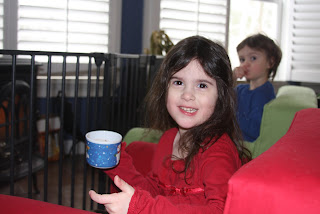 Warming up with hot chocolate by the fire.