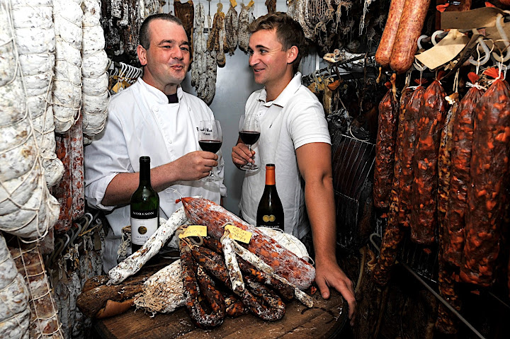 Neil and Clayton enjoying wine, charcuterie and a laugh in Neil meat locker.