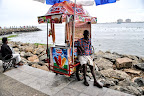 ice cream seller - rainy season is a bad bussiness time for him-Kerala food images