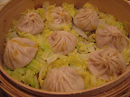 Soup Dumplings with crab "shao long bao" $6.65 + tax/tip = $10. These are only $1 in Shanghai, but the Visa for China was raised to $130 for the Olympics. :-(