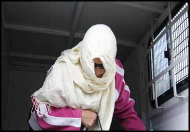 Angelique Cilliers appeared wrapped up in large scarf at Strand court picture Leanne Stander Die Burger