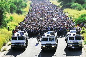 [WE will disrupt WC2010 Oukasie protestors outside Brits 5000 people heading to Madibeng municipal offices March92010[5].jpg]