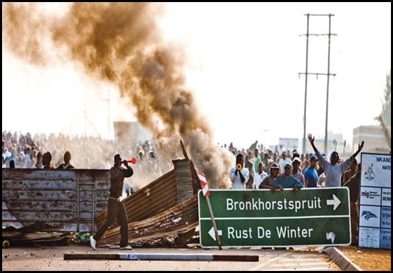Church and houses torched by rioters with vuvuzelas Moloto road Bronkhorstspruit