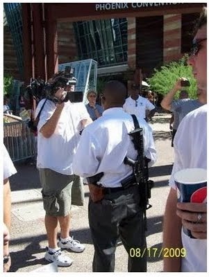 [Arizona health care meet  Aug 17 2009 Armed man was black but face edited out by MSNBC[8].jpg]