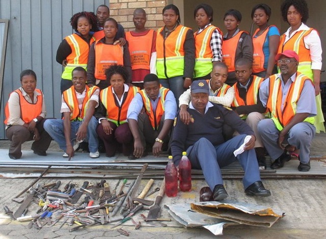 [East London citizen-crime fighters and their haul of confiscated weapons sgt Vusisile Slatsha[4].jpg]