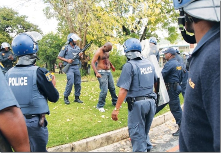 Tatane Andries Shot at close range by police Ficksburg collapses and dies Pic WillemvanderBergVolksblad Tatane Andries Shot at close range by police Ficksburg collapses and dies Pic WillemvanderBergVolksblad