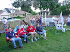 Photo: Some spectators listen to the Kingpin Brass Band.  The girl in the Wisconsin sweatshirt seems intrigued by something.