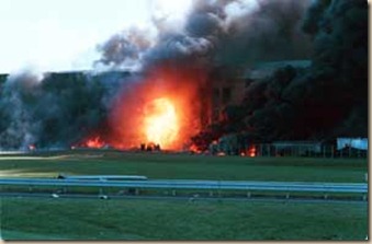 11 September 2001 - Arlington, Virginia - A ball of flame erupts as a commercial airliner crashes inton the Pentagon September 11, 2001. PHOTO CREDIT: DARYL DONLEY / SIPA PRESS