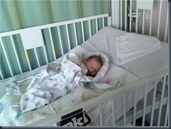 Ella in hospital bed