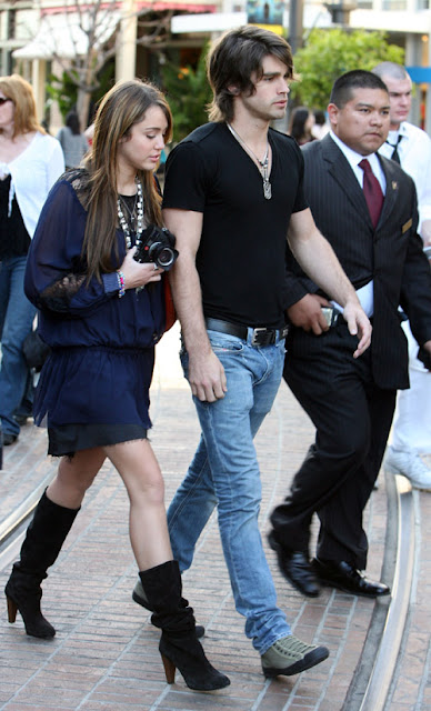 Miley Cyrus and boyfriend Justin Gaston at the Grove Shopping Centre, Los Angeles, Ca. <P> <B>Ref: SPL85317 070309 </B><br> Picture by: London Ent / Splash News<br> Pictured: Miley Cyrus and Justin Gaston </P><P> <B>Splash News and Pictures</B><br> Los Angeles: 310-821-2666<br> New York: 212-619-2666<br> London: 870-934-2666<br> photodesk@splashnews.com<br> </P>