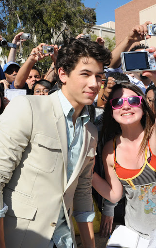 LOS ANGELES, CA - MARCH 28:  Nick Jonas of Jonas Brothers poses with fans at Nickelodeon's 2009 Kids' Choice Awards at UCLA's Pauley Pavilion on March 28, 2009 in Westwood, California.  (Photo by Jeff Kravitz/FilmMagic) *** Local Caption *** Nick Jonas