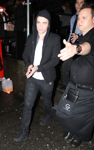 IMAGE ID # 2193052 Robert Pattinson celebrates his 23rd birthday in Vancouver, BC, Canada Wednesday night. Fans endured the rainy weather for a chance to see Robert and he was gracious enough to pose with a few of them before leaving. Despite his last year being a life-changing one for the young heartthrob, Pattinson remained somewhat subdued while celebrating his birthday with castmates and friends. 05/14/2009 --- Robert Pattinson --- (C) 2009 Fame Pictures, Inc. - Santa Monica, CA, U.S.A - 310-395-0500 / Sales: 310-395-0500