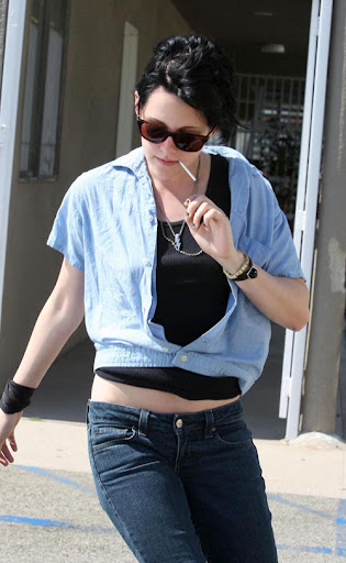 06-19-09 North Hollywood, CA  'Twilight' star Kristen Stewart leaves 'The Runaways' production office with the same sucker that she has been sucking on for 2 hours, poor sucker....also pics of her costume for her movie its says Joan on it...  Non-Exclusive Pix by Flynet &copy;2009 818-307-4813  Nicolas 310-869-0177  Scott