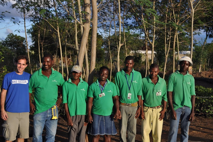 Me standing with the staff of Jatropha Pepinye.  The donated BoGo light hangs from JP Manager George's belt loop.