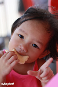 Zaria munching on prawn cracker
