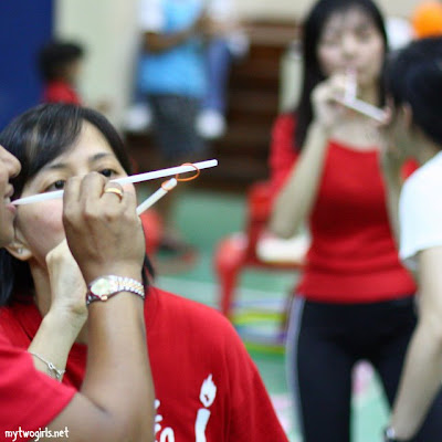Passing the rubber band with a straw