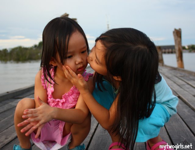 Zara kissing Zaria on the Lovers Bridge