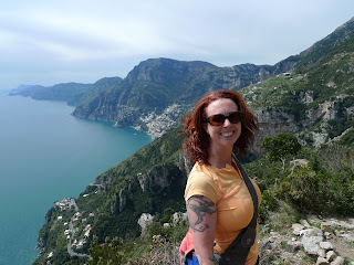 Blue sea, red hair.  Beautiful.