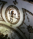 Child skeleton with sickle and scale.