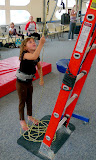 Pulls down her saftey lines.