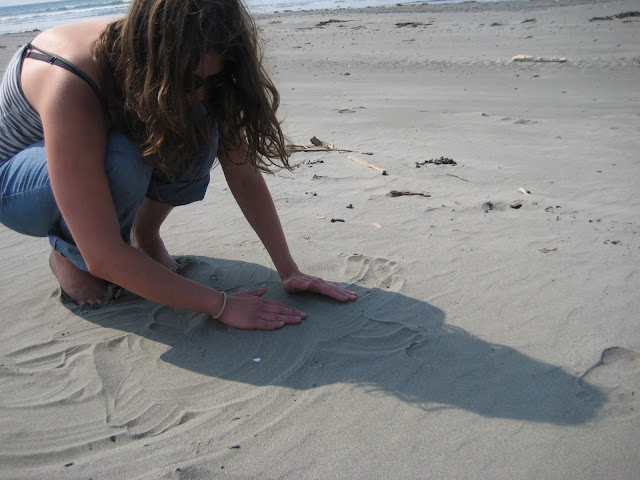 Playing in the sand, in case you couldnt tell.  We were making mazes for miniature sand crabs.