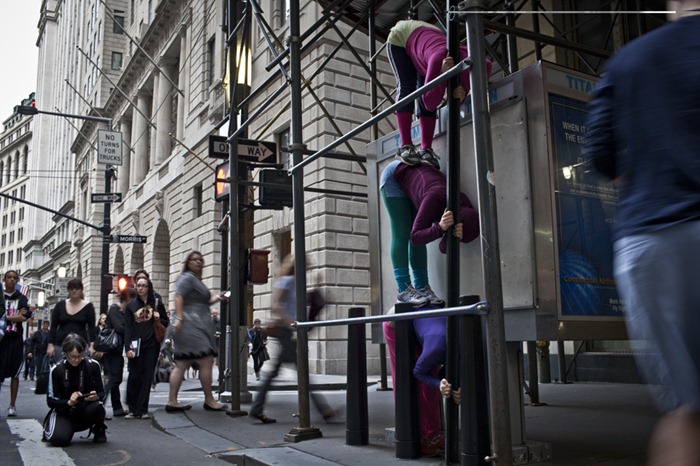 Audience members watch as performers situate themselves into position during a piece entitled "Bodies in Urban Spaces" by choreographer Willi Dorner. Starting at sunrise, the performers inched their way into different spaces throughout lower Manhattan.CREDIT: Bryan Derballa for The Wall Street JournalNYBODIES Audience members watch as performers situate themselves into position during a piece entitled "Bodies in Urban Spaces" by choreographer Willi Dorner. Starting at sunrise, the performers inched their way into different spaces throughout lower Manhattan.CREDIT: Bryan Derballa for The Wall Street JournalNYBODIES