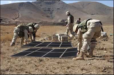 U.S. military personnel preparing to deploy portable solar arrays U.S. military personnel preparing to deploy portable solar arrays.