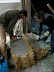 The straw bales are "buttered" with plaster on the "exterior" side to ensure good penetration of the bale