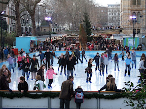 Ice skaters on small and watery rink