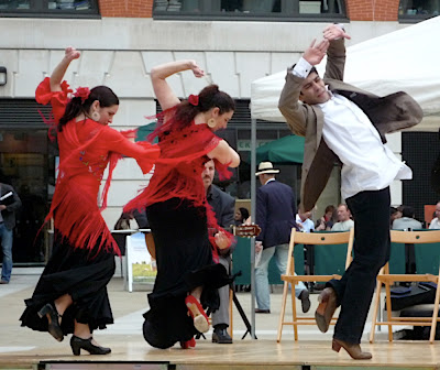 three flamenco dancers spinning