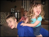 Evie goes for a horsey ride on Daniel