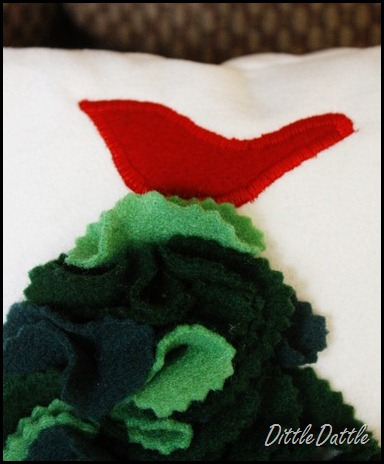 Simple red bird sewn on pillow