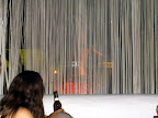 Those white threads are there on purpouse, to avoid people taking pictures of the Pacha cup and the lady dancing on it