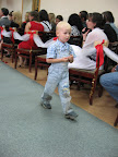 The little boys collecting the flower petals during the service