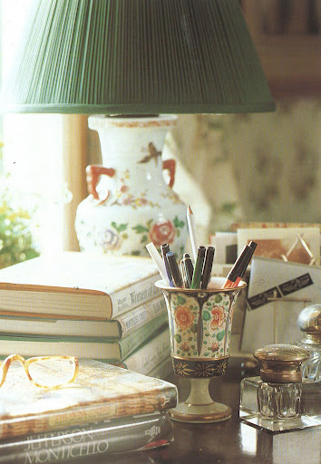 This desktop vignette is something I'd love to recreate in my own way, especially the idea of turning an antique Chinese vase into a lamp and silver toast rack into a letter holder.