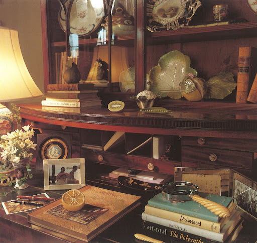 A gorgeous Regency secretary desk.  In case you hadn't noticed, Moss is a master curator of beautiful objets, such as the vegetable and fruit porcelains, spill vase, looking glass and even a piece of dried lemon.
