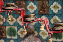 Little oil lamps outside a street temple in Kathmandu, Nepal