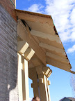 The porch is now flush with the brick wall