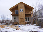 Rear of house with back door and kitchen window