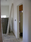 Drywall wrapped doorway between the kitchen and family room
