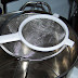 Here are my two favorite strainers. The big one is a long handled one, and because of the way these two set up, the top one does not touch the inside of the bottom one. This works real well.