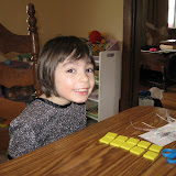 Madeline moving around tiles to practice even and odd numbers