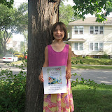 Madeline with her first day of school sign
