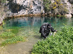A diver enters the Pozo Azul in Covanera.