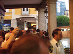 People waiting for the rain to stop during the festivals of Burgos.