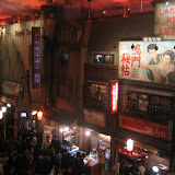 The lower level of the Ramen Museum. The white and red sign for the bakery shop reads “hoomuran beekarii” (homerun bakery).