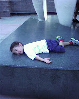 Eidan plays dead on the Awakening statue at Villanova