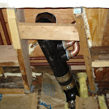 The finished framing and completed plumbing work. The shims are for lining up new drywall with the existing ceiling